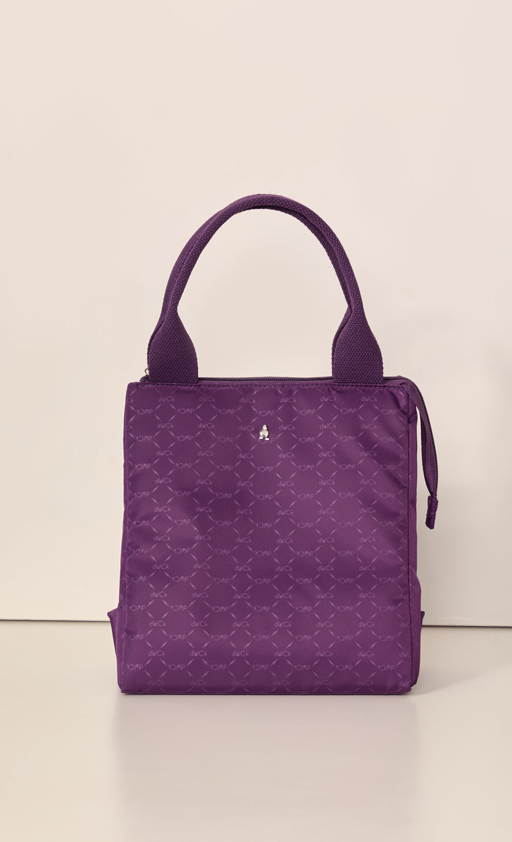 dUCk Monogram Lunch Bag in Purple